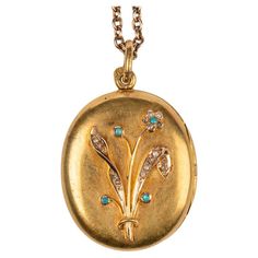 This rare Russian 14k yellow gold locket from St. Petersburg, circa 1900 was created during the Romanov era of Tsar Nicholas II. The front of the oval yellow gold locket applied with a rose gold bouquet set with rose diamonds and turquoise cabochons, opening to reveal two vacant compartments. Stamped St. Petersburg, 1899-1908. 1 9/16 in. ( 4 cm.) long including suspension ring; locket measures 1 3/16 x 1 x 1/4 in. (3 x 2.5 x .6 cm.) (l x w x h). Chain not included. For a Russian imperial-era 25 inch gold rope chain see Ref no. CHFD097B. Ring Locket, Rose Gold Bouquet, Gold Bouquet, Diamond Locket, Gold Locket Necklace, Tsar Nicholas Ii, Tsar Nicholas, Gold Rope Chains, Antique Pendant