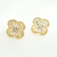 Introducing our exquisite 14k Solid Yellow Gold Diamond Flower Studs, a pair of earrings that exude elegance and sophistication. Handcrafted to perfection with premium quality materials, these diamond studs are truly exceptional. Glistening in the light, the solid gold is stunningly fashioned into delicate flower designs that sit beautifully on your ears.  HIGH QUALITY FLOWER STUD EARRINGS This modern and on-trend design is crafted from genuine 14k Solid Gold and Diamonds! Item number: EFI51229 Studs Diamond, Schmuck Gold, Gold Schmuck, Gold Jewelry Stores, Diamond Quartz, Flower Stud, Sell Gold, Solid Gold Jewelry, Diamond Flower