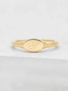 Signet rings are traditionally a symbol of family heritage, but has since then become a staple for gifting and personalization! Make a ring a lot more personal for yourself or for a friend and/or family member. This ring makes a perfect gift for graduations, anniversaries and as bridesmaids gifts! It's intentional is to create a sentimental connection with a date, person or anything else of importance to you! The ring is made of gold plated brass with an engravable surface measuring about 5x8mm. Personalized Signet Ring, Small Signet Ring, Classic 14k Gold Stackable Rings With Initials, 14k Gold Symbolic Rings With Engraving Option, Classic Adjustable Stackable Rings With Initials, Heirloom Engraved Yellow Gold Stackable Rings, Formal Yellow Gold Stamped Engraved Ring, Heirloom Yellow Gold Engraved Stackable Rings, Gold Initial Ring With Engraving Option For Promise