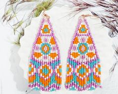 Summer Beaded Fringe Earrings With Round Beads, Summer Beaded Earrings With Fringe And Round Beads, Summer Beaded Earrings With Round Beads And Fringe, Handmade Beaded Earrings For Beach In Summer, Handmade Orange Tassel Earrings For Summer, Bohemian Beaded Earrings For Vacation, Summer Beach Beaded Earrings, Dangle Beaded Fringe Tassel Earrings For Beach, Summer Beaded Fringe Dangle Earrings