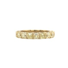 "Yellow Diamond Sunshine" is a gorgeous Asscher cut 3/4 band. Crafted in 14K buttery yellow gold with a high polish finish. 15 Diamonds set in a U-Prong Setting. Diamond color and quality: Fancy Yellow VS1 clarity. 3.60 carat total weight Finger Size: 6.5 This beautiful classic design appears to be full eternity at first glance, as the shape follows all the way to the underside of the shank. We wanted to create an eternity band look while also being able to accommodate sizing. We find that many Yellow 14k Gold Diamond Ring With Prong Setting, Yellow Diamond Ring With Prong Setting In 14k Gold, Classic Yellow Sapphire Diamond Ring With Brilliant Cut, Yellow Gold Jewelry With Single Cut Cushion Diamonds, Yellow Gold Jewelry With Cushion Cut Single Diamonds, Gold Wedding Ring With Rose Cut Baguette Diamonds, Yellow Gold Emerald Cut Diamond Eternity Band, Yellow Gold 14k Rose Cut Diamond Eternity Band, Yellow Gold Cushion Cut Single Cut Diamonds Jewelry