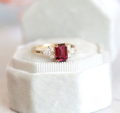 Janine Umba Valley garnet & diamond engagement ring. Buy wedding rings at affordable price at Capucinne. Financing available. FREE insured express shipping wolrdwide! Engagement Ring Floral, Engagement Ring Emerald Cut, Engagement Ring Emerald, Emerald Cut Diamond Engagement Ring, Garnet And Diamond Ring, Garnet Engagement Ring, Red Garnet Ring, Emerald Cut Diamond Engagement, Ring Emerald Cut