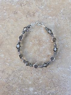 Sterling Silver and Swarovski Crystal Handmade Bracelet, 7.5". All beads are sterling including lobster clasp. Swarovski crystals are 2mm and 8mm bicone Black Diamond.  Check out my other jewelry at https://loveofjewelryshop.etsy.com *All of my Swarovski crystal bracelets, earrings, and necklaces are my own design using beads I purchased over 20 years ago. Silver Crystal Bracelet With Faceted Beads As Gift, Silver Crystal Bracelets With Spacer Beads, Faceted Sterling Silver Beaded Bracelets For Jewelry Making, Adjustable Faceted Silver Beaded Bracelets, Gift Silver Crystal Bracelet With Faceted Beads, Adjustable Sterling Silver Crystal Bracelet With Spacer Beads, Silver Crystal Bracelet With Spacer Beads, Silver Czech Glass Crystal Bracelet For Jewelry Making, Silver Faceted Beaded Jewelry