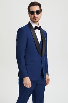 This one button tuxedo by Stacy Adams features a wide black satin shawl lapel, matching pants and vest. This comes in a hybrid fit (Sizes 34-44 = Slim Fit | Sizes 46+ = Modern Fit) Tuxedo With Suit Collar For Gala, Gala Tuxedo With Suit Collar, Tuxedo For Black-tie Events And Galas, Black-tie Gala Tuxedo Suits, Tuxedo Suit With Notch Lapel For Gala, Fitted Blue Tuxedo For Black-tie Events, Blue Tuxedo Three-piece Suit, Evening Tuxedo Sets, Evening Tuxedo Three-piece Suit With Notch Lapel