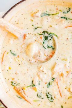 a white bowl filled with soup on top of a table