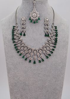 This necklace would make a wonderful accessory choice for the festive season. Its circular floral pattern and beautiful ethnic maang tikka are a great reflection of the rich traditions and aura of our festivals. Neckline Length: 7.5" and The length of the necklace is adjustable by a chain. Earrings Length: Approx. 2" Weight of each earring: 6 gms Push-Back Closure. Tikka length: 1.5" Weight: 10 gms Victorian Finish on high-quality brass as the base metal Availability: In-Stock *Color may vary sl We Are Festival, Maang Tikka, Diamond Necklace Set, Diamond Drops, American Diamond, Cz Diamond, Chain Earrings, Festive Season, Base Metal