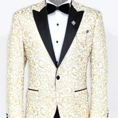 Gold And Ivory Floral Jacket. Single Button Peak Lapel In A Slim Fit. Coat Only. Designer White Blazer For Semi-formal Occasions, White Fall Party Suit, Luxury White Blazer With Buttons, Designer White Blazer With Lapel Collar, White Tuxedo Formal Outerwear, White Notch Lapel Outerwear For Party, White Tuxedo-style Party Outerwear, White Tuxedo Style Party Outerwear, Fitted White Tuxedo With Buttons