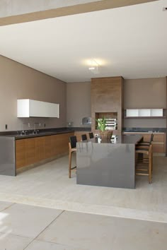 a large kitchen with an island in the middle