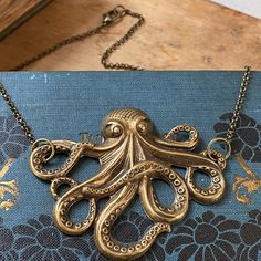 Octopus Necklace | Ragtrader Vintage Vintage Hand Cast Bronze Necklaces, Vintage Hand-cast Bronze Necklaces, Vintage Bronze Hand Cast Necklaces, Vintage Bronze Hand-cast Necklaces, Pirate Octopus, Octopus Necklace, Octopus Pendant, Compass Necklace, One Sided