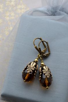 Vintage Bronze Teardrop Earrings, Bronze Antique Finish Drop Earrings, Antique Gold Drop Earrings With Antique Finish, Victorian Wedding Earrings With Antique Finish, Elegant Brown Brass Earrings, Ornate Bronze Jewelry With Antique Finish, Antique Drop Earrings With Antique Finish, Antique Style Drop Earrings With Antique Finish, Vintage Copper Teardrop Earrings