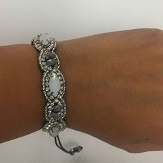 This Hand Stitched Beaded Bracelet Is Simply Stunning. It Features Silvery Hematite Beads, Opalescent Faceted Glass Beads, Silver Seed Beads And Tiny Austrian Crystals. This Artistic Bracelet Has A Macram Pull Cord Adjustable Closure And Is Suede Backed For Comfort. Wear Alone Or Stack Amongst Your Other Braceletsyou Are Bound To Get Compliments! Gift Boxed From Our Ny Boutique! One Size Fits Most Pull Cord Closure Macram Velvet Lined Hand Beaded Hand Stitched Natural Stones Elegant Adjustable Beaded Braided Bracelets, Handmade Adjustable White Crystal Bracelet, Handmade White Adjustable Crystal Bracelet, Handmade White Crystal Adjustable Bracelet, White Beaded Braided Bracelets, White Hand-wrapped Friendship Bracelets, Adjustable White Macrame Bracelets, White Beaded Adjustable Friendship Bracelets, Adjustable White Hand Wrapped Beaded Bracelets