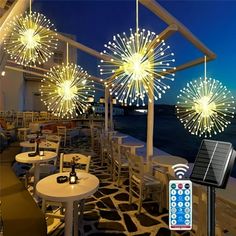 an outdoor restaurant with fireworks on the roof