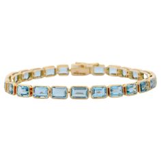 For Sale on 1stDibs - Aquamarine bracelet in 18K Gold. It has a perfect octagon cut gemstone to make you stand out on any occasion or an event. A tennis bracelet is an essential Luxury Yellow Gold Rectangular Tennis Bracelet, Luxury Yellow Gold Emerald Cut Bracelet, Yellow Gold Emerald Cut Tennis Bracelet For Formal Occasions, Emerald Cut Yellow Gold Tennis Bracelet For Formal Events, Emerald Cut Yellow Gold Tennis Bracelet For Formal Occasions, Formal Yellow Gold Emerald Cut Tennis Bracelet, Formal Rectangular Bracelet In Fine Jewelry Style, Rectangular Bracelet For Formal Occasions, Fine Jewelry, Fine Jewelry Rectangular Bracelet For Formal Occasions