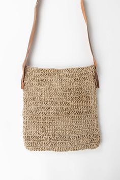 Bring organic style to every outfit with the Crochet Jute Shoulder Bag. A beautiful leather strap hangs at just the right length. Throw in your phone, keys, and wallet, and head out. Ethically handcrafted in small batches by environmentalist artisans with Prokritee, an organization in Bangladesh that provides jobs and skills training for women in under-resourced communities. Prokritee improves women's standard of living with safe jobs, fair wages, and the goal of self-reliance, helping mothers s Keys And Wallet, Crochet Jute, Organic Style, Small Batches, Leather Shoulder Bag, Leather Bag, Leather Straps, Shoulder Bag, Wallet