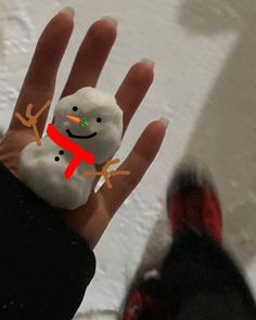 a hand that has a snowman on it