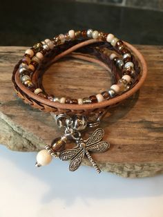 A personal favorite from my Etsy shop https://www.etsy.com/listing/493964844/wrap-bracelet-beaded-boho-wrap-leather Rustic Brown Adjustable Wrap Bracelet, Unique Brown Beaded Wrap Bracelet, Spiritual Hand-wrapped Brown Wrap Bracelet, Earthy Brown Hand-strung Wrap Bracelet, Bohemian Leather Wrap Bracelet, Adjustable, Natural Tan, Beaded Wraps, Bead Leather, Braided Bracelets