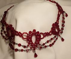 Very beautiful and unique necklace. Made from little glass/crystals beads bonded together into collar. Elegant Red Beaded Choker, Red Crystal Beaded Necklaces With Round Beads, Red Necklaces With Bead Caps, Red Crystal Beaded Necklace With Round Beads, Adjustable Red Beaded Chain Choker, Adjustable Red Beaded Choker, Red Necklaces With Bead Caps For Gifts, Red Beaded Chain Choker Necklace, Red Beaded Choker For Party