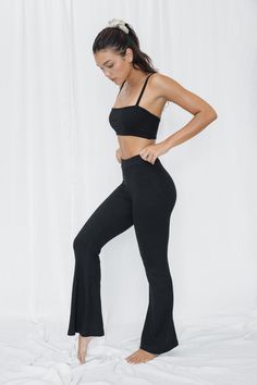 Versatile and stylish, our Rib Flares are perfect for Yoga, Pilates or as a chic street outfit. Wear them high-waisted or mid-rise to suit your style. Featuring a softly flared leg cut, they offer comfort and a delicate feel. Elevate your wardrobe with the Rib Flares. Made from environmentally friendly ECOVERO™ ribbed fibers. Organic fabric that feels like a second skin Buttery soft and stretchy Hugs your curves at the right places High-Rise or Mid-Rise Softly Flared Leg Cut Inseam Length: Size Chic Elastane Yoga Pants For Loungewear, Athleisure Flare Pants For Loungewear, Fitted Mid-rise Wide Leg Elastane Pants, Casual Flare Bottoms With High Stretch, Chic High-waist Flares For Night Out, Chic High Waist Flares For Night Out, Casual Flare High Stretch Bottoms, Casual High-stretch Flare Bottoms, Black Fitted Wide-leg Flares