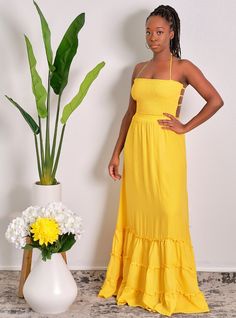 You'll be walking on sunshine all summer long in this darling mustard yellpw pleated smocked maxi dress! We're loving the maxi length (fully lined by the way), elasticated tube top shirring and flattering multi-strap back. You'll kill this with a pair of nude sandals and your fave hand bag CONTENT & CARE Hand wash with cold water Polyester DEETS & FIT Model is wearing a size Medium Fabric has some stretch in the top smocked area Model profile: Uche is 5'9" and measures 34 (bust) 27 (waist) and 4 Bohemian Ruched Maxi Dress For Vacation, Summer Smocked Maxi Length Dress, Summer Brunch Maxi-length Smocked Dress, Ruched Maxi Dress For Summer, Summer Style Ruched Maxi Dress, Chic Fitted Maxi Dress With Elastic Back, Summer Ruched Maxi Dress, Flowy Smocked Maxi Dress With Elastic Neckline, Flowy Maxi Smocked Dress With Elastic Neckline