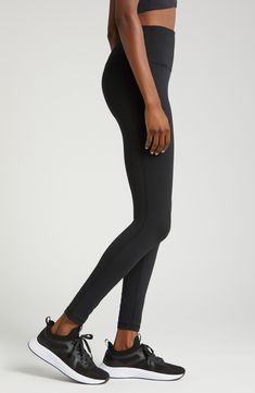 The moisture-wicking tech of stretchy, brushed Zeltek fabric keeps you cool as your workout warms up in these leggings topped with a high, slip-free waistband. 29" inseam; 8 1/2" leg opening;  (size Medium) Elastic waistband with hidden pocket Brushed, moisture-wicking fabric dries quickly to keep you cool and comfortable Smooth flatlock seaming designed to eliminate rubbing and irritation 88% polyester, 12% spandex Machine wash, tumble dry Imported Sporty Compressive Leggings For Training, Moisture-wicking Compression Activewear With 5-inch Inseam, Sporty Compressive Training Leggings, Sporty Stretch Activewear With 5-inch Inseam, Sporty Go-dry Tights For Training, Compressive Athleisure Tights For Training, Sporty Yoga Pants With 4-way Stretch And 5-inch Inseam, Black Yoga Pants With 5-inch Inseam For Gym, Black 4-way Stretch Leggings For Sports