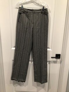 NWOT Dressbarn women’s size 4 dress pants Gray light blue white pinstripes Hook and eye and zipper in front 65% polyester 32% viscos Has belt loops  2 pockets in front 2 pockets in back  Measurements 30 inches waist  40 inches length 31 inches inseam  Hem on right leg needs to be restitched Excellent condition  A61 Business Striped Pants With Belt Loops, Formal Dress Pants With Vertical Stripes And Straight Leg, Tailored Striped Dress Pants With Welt Pockets, Tailored Striped Straight Leg Dress Pants, Tailored Striped Dress Pants With Straight Leg, Striped Dress Pants With Welt Pockets For Business, Formal Striped Pants With Welt Pockets, Formal Striped Bottoms With Belt Loops, Formal Dress Pants With Vertical Stripes