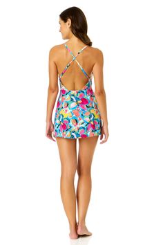 You'll love how confident you feel in our Swim Dress With Skirted Bottom. This one piece swim dress is designed with a colorful floral design making you the center of attention everywhere you go. With its skirted swim bottom, you can enjoy the beach in comfort whether you're relaxing by the pool or enjoying the water. Adjustable back straps and removable cups provide customizable support and a secure fit. Complete your look by pairing it with any Anne Cole cover up! Summer Beach Tankini With Built-in Liner, Spring Vacation Swim Dress With Built-in Bra, Stretch Multicolor Swim Dress For Summer, Beach Swim Dress With Built-in Liner And Stretch, Stretch Swim Dress With Built-in Liner For Beach, Multicolor Stretch Swim Dress For Beach Party, Fitted Multicolor Swim Dress, Floral Print Swim Skirt For Summer Vacation, Printed Swim Skirt For Poolside Beachwear