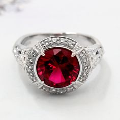 Women Sterling Silver Art Deco Design 2.5 carat Simulated Ruby Engagement Ring This beautiful Sterling Silver Art Deco Design 2.5ct Simulated Ruby Engagement Ring by DoubleAccent is meticulously crafted in gleaming and durable Sterling Silver. Our stones are the highest quality diamond simulants that are polished, finely cut, loupe clean, and have an exactly similar appearance and as beautiful as to naturally occurring diamonds. All cubic zirconia stone weights are approximate and listed as diam Vintage Halo Ring, Edwardian Engagement Ring, Vintage Halo, Edwardian Ring, Sterling Silver Wedding Rings, Ruby Engagement Ring, Silver Wedding Bands, Gold And Silver Rings, Etsy Wedding Rings