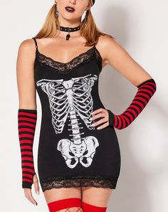 Show off your love of the dark side with this stylish Skeleton Cami Mini Dress! Pair this black cami with your favorite shorts or skirt or wear it on its own and create a whole outfit that's perfect for spooky season or any time of year. Exclusively at Spencer's Length: About 28" from shoulder to hem Material: Cotton, spandex, polyester Care: Machine wash Imported Note: Jewelry, stockings, shoes and gloves sold separately Alt Girl Fashion, Alt Girl Outfits, Alternative Fashion Outfits, Skeleton Dress, Cami Mini Dress, Black Cami, Alternative Style, Mini Cami Dress, Alt Girl