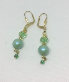 Dainty green bead dangle earrings in shades of green . Perfect as a gift or treat for yourself! Matching necklace also on this site. Green Pearl Drop Necklace Gift, Green Pearl Drop Necklace For Gift, Elegant Green Beaded Drop Earrings, Beaded Jade Earrings As A Gift, Green Beaded Dangle Necklaces, Nickel-free Green Beaded Earrings For Parties, Green Dangle Necklace With Beads, Green Necklaces With Dangling Beads, Elegant Green Hypoallergenic Beaded Earrings