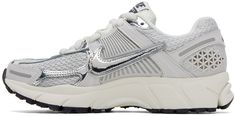 Low-top mesh and rubberized sneakers in gray. Metallic silver-tone trim throughout. · Lace-up closure · Padded tongue and collar · Signature Swoosh appliqué at sides · Cushlon foam rubber midsole · Treaded rubber outsole Please note that this item may be shipped only within North America. Supplier color: Photon dust/Chrome/Gridiron Nike For Women, Zoom Vomero 5, Nike Clothing, Vomero 5, Nike Outfits, Luxury Streetwear, Low Top, Metallic Silver, North America