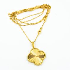 Luck will always be on your side with our Vintage Clover Pendant Necklace in Gold. Show off your unique style with this one-of-a-kind piece that adds a touch of elegance and charm to any outfit. A perfect gift for someone special (or yourself!), this necklace is sure to bring good fortune wherever you go. Who needs a four-leaf clover when you have this stunning pendant around your neck? Go ahead, make a statement and embrace your inner fashionista! ADDITIONAL INFORMATION Color: Gold Stone: no Re Luxury Long Brass Necklace, Luxury Large Pendant Necklace For Anniversary, Luxury Gold Plated Pendant Chain Necklace, Gold Necklace With Flower Pendant Clavicle Chain, Luxury Yellow Gold Sterling Silver Chain Necklace, Luxury Brass Necklace With Round Pendant, Hallmarked Yellow Gold Flower Pendant Necklace, Luxury Gold-tone Pendant Necklace, Luxury Clavicle Chain Necklace With Flower Pendant