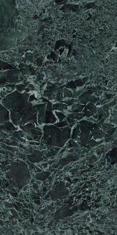 a black and white marble textured wallpaper with dark green veiners on it