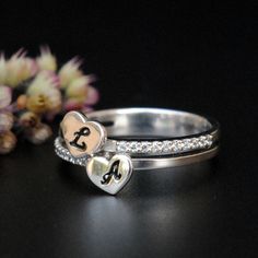 Special customized rings, with initials carved in hearts, this lovely piece of jewellery is multipurpose. It makes for a very special wedding/engagement ring, cute and special bridesmaid gifts as well as personalized gifts for any occasion...! :) * Diamond Wt. : 0.15 Cts * Color-Clarity Grade : Near Colorless, Vs-Si * Gold - 14k, 3 gms solid yellow gold Custom Initials - Two Initials - Double Diamond Band - Customized Jewellery This ring can be made in 14Kt Yellow/Rose gold, 18Kt Yellow/White/Ro L Engagement Ring, Personalized White Stackable Rings For Anniversary, Sterling Silver Initials Ring For Anniversary, Personalized Silver Initial Ring For Anniversary, White Initial Ring For Promise, Personalized Initial Ring In White For Anniversary, White Gold Engraved Initial Ring For Anniversary, Sterling Silver Engraved Initial Ring For Wedding, Wedding Initial Ring In White Sterling Silver