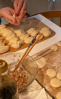 the person is making dumplings on the table