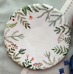 a white plate sitting on top of a table next to some red and blue decorations