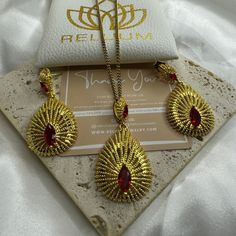 Elevate Your Style with ReluumJewellery's Country Map Pendant Necklaces: Introducing our Habesha Ethiopian Jewelry Set, a dazzling ensemble inspired by the rich cultural heritage of Ethiopia. Crafted with intricate designs and vibrant colors, this set features a stunning necklace and matching earrings, exquisitely adorned with traditional Habesha motifs and craftsmanship. Each piece is a testament to the beauty and elegance of Ethiopian jewelry, reflecting centuries of tradition and artistry. Wh Red 22k Gold Earrings For Wedding, Red 22k Gold Wedding Earrings, Festive 22k Gold Bridal Earrings, Festival Filigree Jewelry Sets For Gifts, Filigree Jewelry Sets For Festivals And Gifts, Festive Filigree Jewelry Sets As Gifts, 22k Gold Temple Jewelry Sets As Gift, 22k Gold Teardrop Jewelry For Wedding, Temple Jewelry Sets With Filigree For Gifts