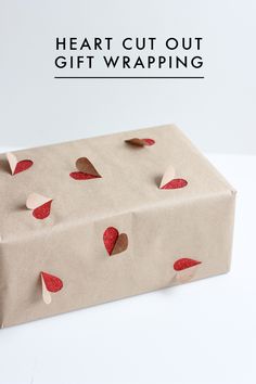 a brown paper bag with red hearts on it