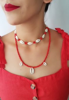 Natural Shell Adjustable Seashell necklace Top Beautiful choker necklace ♥ White color natural shells (with 10 pieces natural cowrie ) ( shells). coral color seed bead ♥min lenght 13 inch ---- max lenght 28 inch ♥ Coral color seed bead necklace 1 big-2 small cowrie- 21 inch ♥Can be worn in different lengths to fit your each time needs. Adjustable closure that tightens and looses with ease for the perfect fit. Just pull the endings and the necklace will close on the length you wish. ♥min lenght 1 Little Mermaid Necklace, Seashell Choker, Cool Rings For Men, Beautiful Chokers, Necklace Top, Shell Choker, Cowrie Shells, Boho Choker, Seashell Necklace