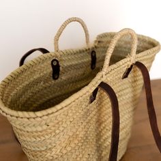 This handmade French market basket is charming and versatile. Take it everywhere from the lake, farmer's market and to run errands. The double handles make it practical and comfortable to carry. Dimensions | 20" W x 13" H Material | Straw palm leaf, genuine vegetable-tanned leather, rope Slight variations may occur due to this being a handmade item French Market Basket, Market Basket, French Market, Market Baskets, Farmer's Market, Palm Leaf, Vegetable Tanned Leather, Vintage Gifts, Spring Summer Fashion