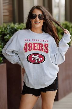 Designed for the ultimate fan, our San Francisco 49Ers drop shoulder long sleeve tee combines a relaxed fit, heathered finish and luxurious French Terry knit. With a ribbed neckline and cuffs, you'll stay stylish and comfortable while showing your unwavering team support. Game Day Graphic Print Long Sleeve Sweatshirt, Fall Fan Gear Long Sleeve Sweatshirt, Game Day Fan Apparel Long Sleeve Sweatshirt, Fall Season Team Logo Sweatshirt, Oversized Fan Apparel Tops For Game Day, Relaxed Fit Long Sleeve Fan Apparel Top, Sporty Long Sleeve Top For Game Day, Game Day Long Sleeve Graphic Print Top, Game Day Long Sleeve Tops With Team Logo