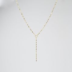 "14k Gold Y Necklace. 14K sparkle chain necklace. 14k delicate y necklace. This necklace is beautiful and delicate. The necklace will arrive in a gift box, ready for delivery. 14K gold necklace 14K gold drop chain (The picture in the listing is 2\") All components are 14k gold Please read our policies before you place your order. https://www.etsy.com/shop/SashJewelry/policy?ref=shopinfo_policies_leftnav To see other bracelets click here https://www.etsy.com/shop/SashJewelry?section_id=12354075&a Long Drop Yellow Gold Necklace With Delicate Chain, Gold Backdrop Necklace With Delicate Long Drop Chain, Dainty Gold Long Drop Backdrop Necklace, Delicate Yellow Gold Lariat Backdrop Necklace, 14k Gold-filled Drop Necklace With Delicate Chain As Gift, Gold Heart Bracelet, Mother Daughter Necklace, Small Bracelets, Daughter Necklace