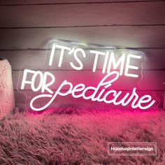 a neon sign that says it's time for bedlame on the floor