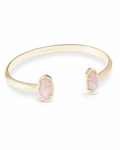 A dainty pinch cuff bookended with our signature oval stones, the Elton Gold Cuff Bracelet in Rose Quartz is a stack staple. This beautifully designed gold cuff bracelet is guaranteed to turn heads every time you wear it. No matter the size of your wrist, our Elton Cuff Bracelet is sure to fit you and your style. Kendra Scott Bracelet, Gold Cuff Bracelet, Rose Quartz Jewelry, Rose Gold Quartz, Quartz Jewelry, Gold Bracelet Cuff, Gold Cuffs, Jewelry Lookbook, Kendra Scott Jewelry