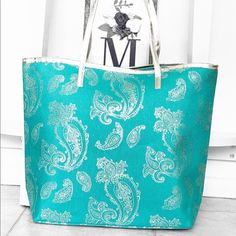 Brand New Teal Turquoise Metallic Tote Bag. Gold Metallic Foil Paisley Print. Metallic Gold Straps. Single Snap Button Closure. One Inner Pocket. Polyester Lining. Beautiful Must Have Tote For Summer. Price Is Firm Teal Turquoise, Metallic Foil, Metallic Gold, Womens Tote Bags, Paisley Print, Snap Button, Gold Metal, Paisley, Blue Green