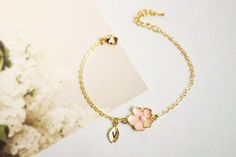 Super dainty Personalized Cherry blossom bracelet. ▶▶ You can make this necklace personal choosing the quantity of letter leaf from option. Please leave a note for the desired letters in 'add your personalization' ▶ Material - Gold plated over brass, Pearl ▶ Chain Length - 5 ~ 9 inches (Please choose it from option) ▶ charm measure - Flower H. 14mm x W. 13mm, Initial leaf ▶ The matching necklace available https://www.etsy.com/listing/196300602/cherry-blossom-necklace-sakura-necklace The matching Pink Flower Charm Jewelry For Bridesmaid Gift, Flower-shaped Bracelets For Bridesmaids, Flower Charm Bracelet As A Gift, Dainty Flower Shaped Personalized Bracelets, Cute Rose Gold Flower Jewelry, Rose Gold Flower Charm Bracelet As Gift, Elegant Charm Bracelet With Flower Charm As Gift, Gold Flower Charm Bracelet For Weddings, Elegant Flower Charm Bracelet Gift