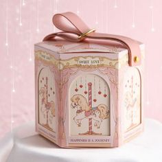 a small pink box with a horse on it