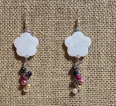 "2.5\" Dangle earrings with White mother of pearl shell flower shaped and multi-colored pearl complimentary beads and silver accents." White Mother Of Pearl Flower-shaped Earrings, Handmade White Flower Pearl Earrings, White Mother Of Pearl Flower Earrings, Pearl Shell, Pearl Color, Silver Accents, Flower Shape, Flower Earrings, Multi Colored