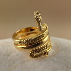 Snake ring made of 18 carat solid yellow gold Snake was the symbol of health in ancient Greece It's made with detailed handmade workmanship Made in Greece in our workshop in Athens A beautiful piece of jewelry that can be an unique gift for any special occasion For more information don't hesitate to contact us SHIPPING INFORMATION FREE SHIPPING VIA DHL EXPRESS Please fill in an active phone number It's required by the courier company DELIVERY TIME INFORMATION 1 - 3 Days EUROPE 3 - 5 Days to U.S. 22k Gold Antique Rings For Ceremonial Occasions, Antique 22k Gold Rings For Ceremonial Occasions, Antique 22k Gold Ceremonial Rings, Elegant Ceremonial Yellow Gold Rings, Elegant Yellow Gold Ceremonial Rings, Luxury Polished Yellow Gold Snake Ring, Luxury Yellow Gold Snake Ring With Polished Finish, Yellow Gold Brass Rings For Anniversary, Elegant Ceremonial Rings In 14k Gold