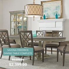 a dining room table with chairs and a chandelier