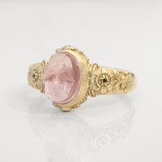 This vintage style peony-themed signet ring, featuring beautiful little peony flowers and leaves with fluorishes all around the center which displays a lovely pink tourmaline cabochon.  This ring can be customized with any letter or word (provided it fits) and is made in solid gold. This ring can be made for men or women and in your preferred size or color of gold. A phrase or letter may be written on the inside, too! Measurements: 10 x 12mm Material: 8K or 14K solid gold (rose, white or yellow) Luxury Vintage Cameo Signet Ring, Vintage Flower Shaped Jewelry With Rose Cut Diamonds, Vintage Flower Ring With Gemstone, Vintage Flower Shaped Gemstone Ring, Vintage Birth Flower Rings For Anniversary, Vintage Gemstone Flower Promise Ring, Vintage Rose Design Rings For Wedding, Vintage Wedding Rings With Rose Design, Vintage Rose Design Wedding Rings